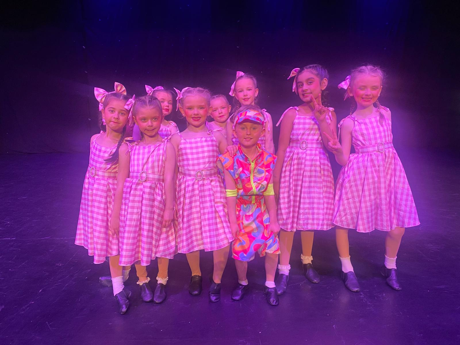 Acro dancers holding balance pose during performance